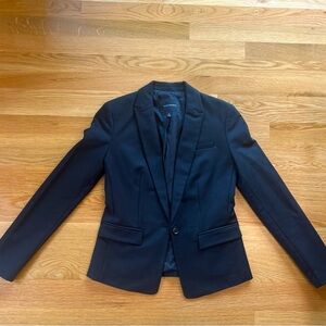 Barely worn tailored jacket. Beautifully lined with three button sleeve accent.